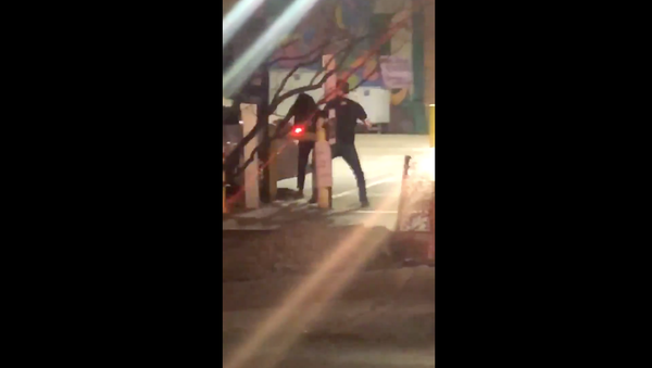 US man arrested by Texas' Dallas Police Department for repeatedly punching woman over parking lot confrontation - Sputnik International