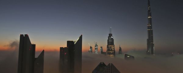 The sun rises over the city skyline with the Burj Khalifa, world's tallest building at the backdrop, seen from a balcony on the 42nd floor of a hotel on a foggy day in Dubai, United Arab Emirates, Saturday, Dec. 31, 2016 The sun rises over the city skyline with the Burj Khalifa, world's tallest building at the backdrop, seen from a balcony on the 42nd floor of a hotel on a foggy day in Dubai, United Arab Emirates, Saturday, Dec. 31, 2016 - Sputnik International