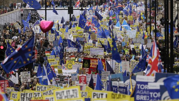 Demonstrators carry posters and flags during a Peoples Vote anti-Brexit march in London, Saturday, March 23, 2019 - Sputnik International