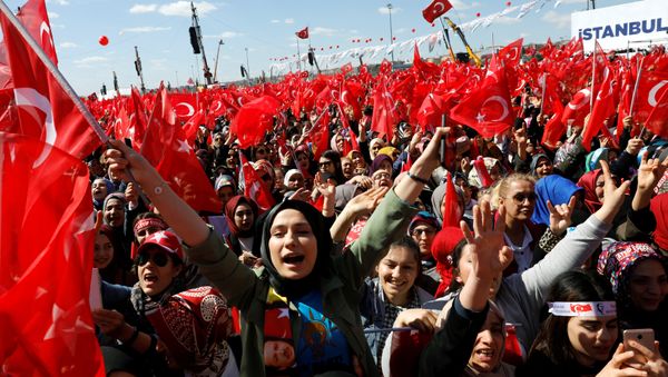 Turkish President Tayyip Erdogan's supporters are seen ahead of a rally for the upcoming local elections, in Istanbul, Turkey March 24, 2019. - Sputnik International