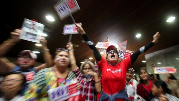 Supporters of Pheu Thai Party react after unofficial results, during the general election in Bangkok, Thailand, March 24, 2019 - Sputnik International
