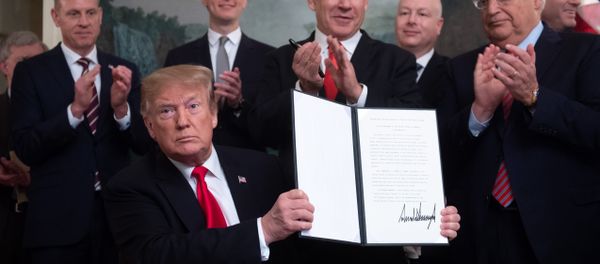 U.S. President Donald Trump holds a proclamation recognizing Israel's sovereignty over the Golan Heights as he is applauded by Israel's Prime Minister Benjamin Netanyahu and others during a ceremony in the Diplomatic Reception Room at the White House in Washington, U.S., March 25, 2019 U.S. President Donald Trump holds a proclamation recognizing Israel's sovereignty over the Golan Heights as he is applauded by Israel's Prime Minister Benjamin Netanyahu and others during a ceremony in the Diplomatic Reception Room at the White House in Washington, U.S., March 25, 2019 - Sputnik International