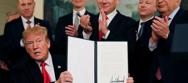 U.S. President Donald Trump holds a proclamation recognizing Israel's sovereignty over the Golan Heights as he is applauded by Israel's Prime Minister Benjamin Netanyahu and others during a ceremony in the Diplomatic Reception Room at the White House in Washington, U.S., March 25, 2019 U.S. President Donald Trump holds a proclamation recognizing Israel's sovereignty over the Golan Heights as he is applauded by Israel's Prime Minister Benjamin Netanyahu and others during a ceremony in the Diplomatic Reception Room at the White House in Washington, U.S., March 25, 2019 - Sputnik International