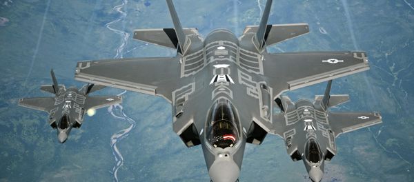 F-35A Lightning II aircraft receive fuel from a KC-10 Extender from Travis Air Force Base, Calif., July 13, 2015, during a flight from England to the U.S. The fighters were returning to Luke AFB, Ariz., after participating in the world's largest air show, the Royal International Air Tattoo. - Sputnik International