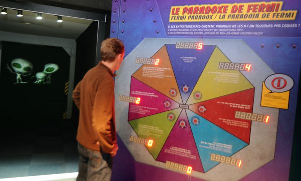 A person stands by a presentation on the paradox of Fermi, the Italian physicist, on April 1, 2010 at a new scientific exhibition on extraterrestrial activity at the 'Cite de l'espace' in Toulouse, south west France - Sputnik International