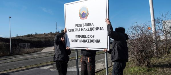 People are at work to set up a sign reading 'Republic of North Macedonia' People are at work to set up a sign reading 'Republic of North Macedonia' - Sputnik International
