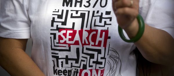A relative of a Chinese passenger who was aboard missing Malaysia Airlines Flight 370 wears a shirt reading MH 370 Search - Keep it On as she speaks to the media near the Malaysian Embassy in Beijing, China, Thursday, Aug. 16, 2018 A relative of a Chinese passenger who was aboard missing Malaysia Airlines Flight 370 wears a shirt reading MH 370 Search - Keep it On as she speaks to the media near the Malaysian Embassy in Beijing, China, Thursday, Aug. 16, 2018 - Sputnik International