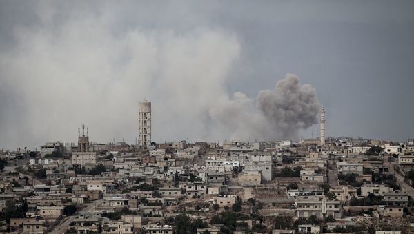 In this Sept. 19, 2013, file photo, smoke rises after a TNT bomb was thrown from a helicopter (archive) - Sputnik International