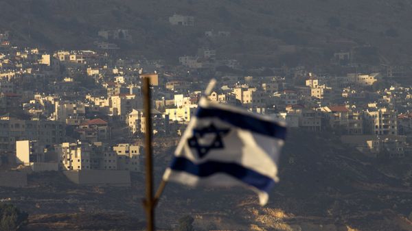 Oct. 11, 2018, an Israeli flag in front of the village of Majdal Shams in the Israeli-controlled Golan Heights. Syria slammed President Donald Trump's abrupt declaration that Washington will recognise Israel's sovereignty over the Israeli-occupied Golan Heights, saying Friday March 22, 2019, the statement was irresponsible and a threat to international peace and stability - Sputnik International