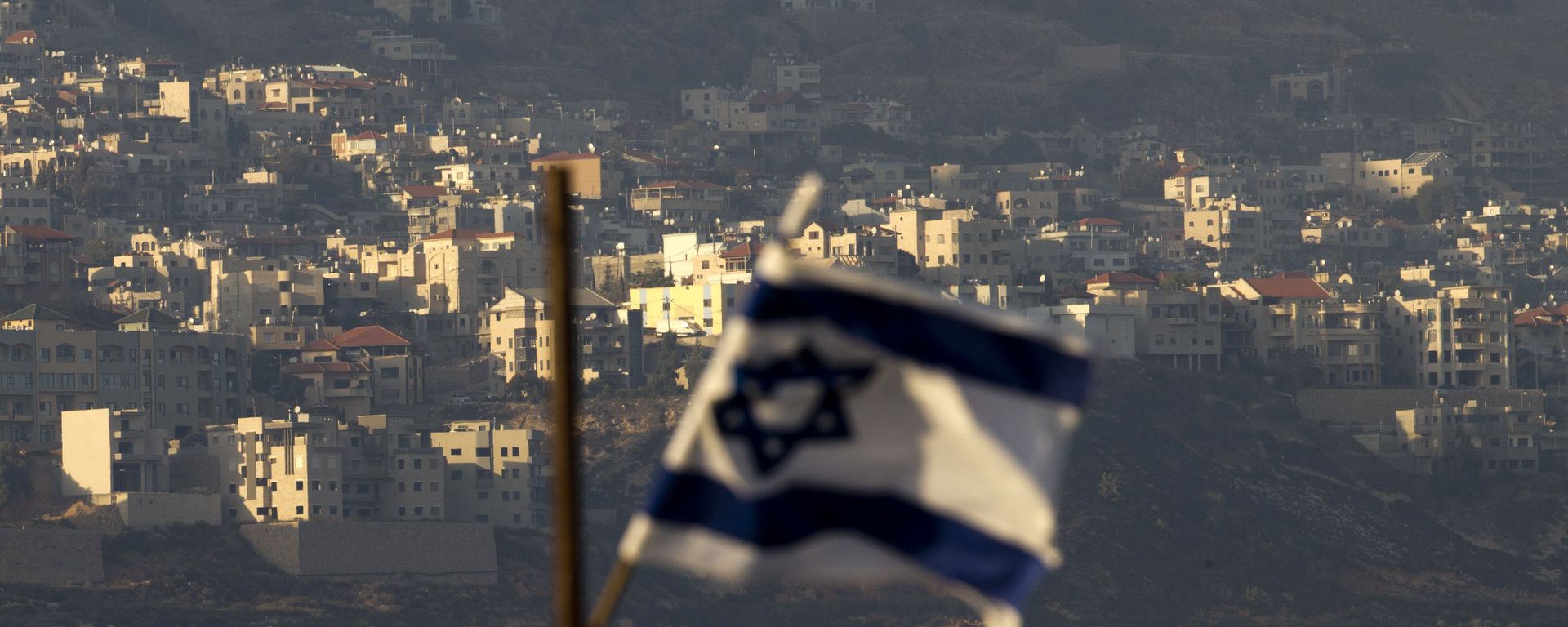 Oct. 11, 2018, an Israeli flag in front of the village of Majdal Shams in the Israeli-controlled Golan Heights. Syria slammed President Donald Trump's abrupt declaration that Washington will recognise Israel's sovereignty over the Israeli-occupied Golan Heights, saying Friday March 22, 2019, the statement was irresponsible and a threat to international peace and stability Oct. 11, 2018, an Israeli flag in front of the village of Majdal Shams in the Israeli-controlled Golan Heights. Syria slammed President Donald Trump's abrupt declaration that Washington will recognise Israel's sovereignty over the Israeli-occupied Golan Heights, saying Friday March 22, 2019, the statement was irresponsible and a threat to international peace and stability - Sputnik International, 1920, 28.12.2021