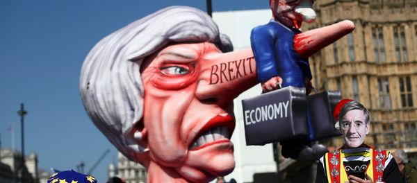 A man wearing a mask of Britain's Conservative Party MP Jacob Rees-Mogg is pictured next to anti-Brexit protesters outside the Houses of Parliament in London, Britain April 1, 2019 A man wearing a mask of Britain's Conservative Party MP Jacob Rees-Mogg is pictured next to anti-Brexit protesters outside the Houses of Parliament in London, Britain April 1, 2019 - Sputnik International