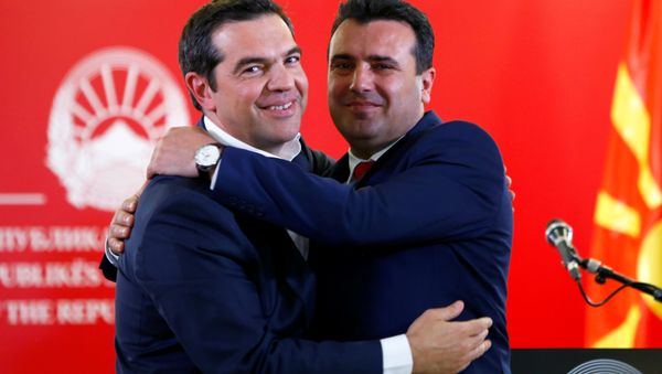 Greek Prime Minister Alexis Tsipras and North Macedonia's Prime Minister Zoran Zaev hug as they attend a news conference in Skopje, North Macedonia April 2, 2019. Greek Prime Minister Alexis Tsipras and North Macedonia's Prime Minister Zoran Zaev hug as they attend a news conference in Skopje, North Macedonia April 2, 2019. - Sputnik International