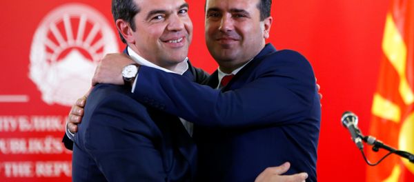 Greek Prime Minister Alexis Tsipras and North Macedonia's Prime Minister Zoran Zaev hug as they attend a news conference in Skopje, North Macedonia April 2, 2019. - Sputnik International