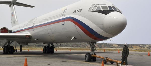 A Russian Ilyushin Il-62M Air Force plane, one of the two Russian military planes that arrived with troops and equipment to Venezuela last weekend, sits on the tamrac at Simon Bolivar International Airport on March 29, 2019 in Maiquetia, Vargas state, northern Venezuela A Russian Ilyushin Il-62M Air Force plane, one of the two Russian military planes that arrived with troops and equipment to Venezuela last weekend, sits on the tamrac at Simon Bolivar International Airport on March 29, 2019 in Maiquetia, Vargas state, northern Venezuela - Sputnik International