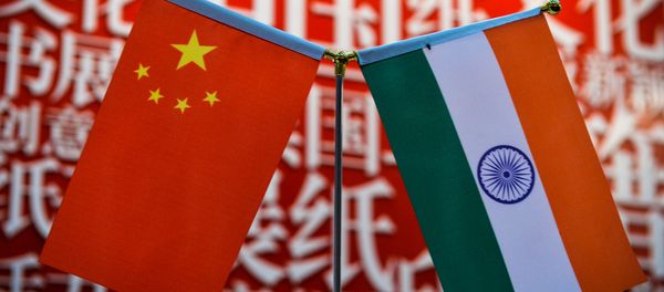 The national flags of India (R) and China are seen at the Delhi World Book fair at Pragati Maidan in New Delhi on January 9, 2016 - Sputnik International