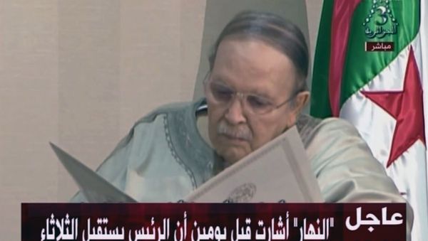 In this image from state TV broadcaster ENTV, Algerian President Abdelaziz Bouteflika, sitting in wheelchair, views the document as he presents his resignation to president of Constitutional Council Tayeb Belaiz, during a meeting Tuesday April 2, 2019. In this image from state TV broadcaster ENTV, Algerian President Abdelaziz Bouteflika, sitting in wheelchair, views the document as he presents his resignation to president of Constitutional Council Tayeb Belaiz, during a meeting Tuesday April 2, 2019. - Sputnik International