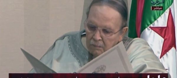 In this image from state TV broadcaster ENTV, Algerian President Abdelaziz Bouteflika, sitting in wheelchair, views the document as he presents his resignation to president of Constitutional Council Tayeb Belaiz, during a meeting Tuesday April 2, 2019. In this image from state TV broadcaster ENTV, Algerian President Abdelaziz Bouteflika, sitting in wheelchair, views the document as he presents his resignation to president of Constitutional Council Tayeb Belaiz, during a meeting Tuesday April 2, 2019. - Sputnik International