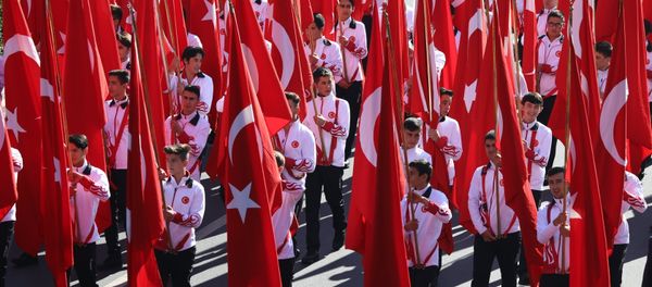 Students hold Turkish flags prior to a ceremony at the mausoleum of Turkey's founder Mustafa Kemal Ataturk on Republic Day in Ankara, Turkey, Monday, Oct. 29, 2018 - Sputnik International