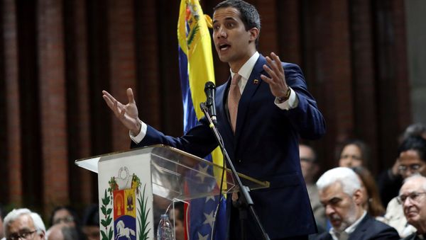 Venezuelan opposition leader Juan Guaido, who many nations have recognized as the country's rightful interim ruler, attends a meeting with political leaders at a university in Caracas, Venezuela April 1, 2019 - Sputnik International