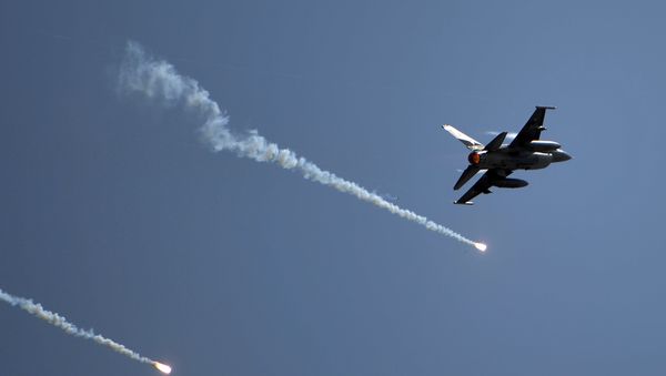 A Pakistani F-16 fighter drops flares during celebrations to mark Defence Day at the Nur Khan military airbase in Islamabad on September 6, 2016 A Pakistani F-16 fighter drops flares during celebrations to mark Defence Day at the Nur Khan military airbase in Islamabad on September 6, 2016 - Sputnik International