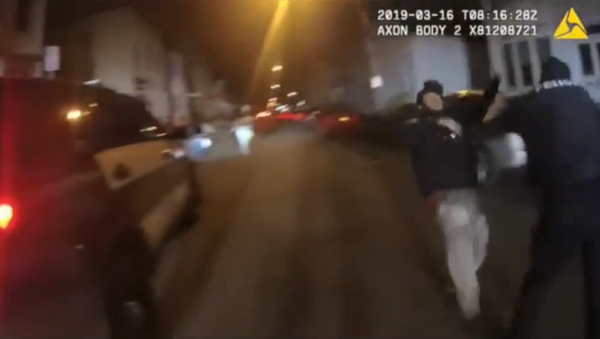 New York's Albany Police Department releases body camera footage showing officer brutally attacking man who had already surrendered - Sputnik International