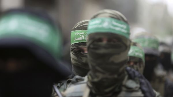 Masked Palestinian Hamas gunmen attend a funeral for six of their fighters who were killed in an explosion Saturday, in Deir el-Balah, central Gaza Strip - Sputnik International