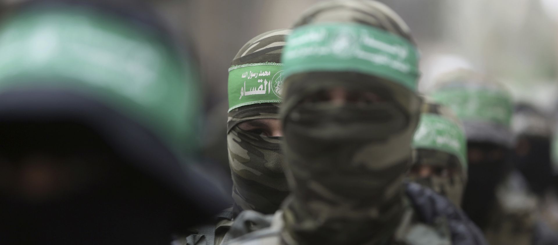 Masked Palestinian Hamas gunmen attend a funeral for six of their fighters who were killed in an explosion Saturday, in Deir el-Balah, central Gaza Strip Masked Palestinian Hamas gunmen attend a funeral for six of their fighters who were killed in an explosion Saturday, in Deir el-Balah, central Gaza Strip - Sputnik International, 1920, 21.01.2021