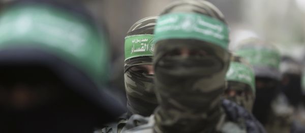 Masked Palestinian Hamas gunmen attend a funeral for six of their fighters who were killed in an explosion Saturday, in Deir el-Balah, central Gaza Strip Masked Palestinian Hamas gunmen attend a funeral for six of their fighters who were killed in an explosion Saturday, in Deir el-Balah, central Gaza Strip - Sputnik International