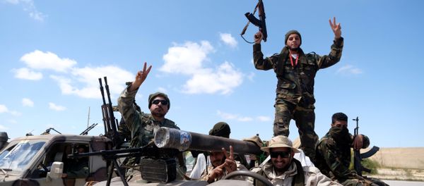 Libyan National Army (LNA) members, commanded by Khalifa Haftar, head out of Benghazi to reinforce the troops advancing to Tripoli, in Benghazi, Libya April 7, 2019 Libyan National Army (LNA) members, commanded by Khalifa Haftar, head out of Benghazi to reinforce the troops advancing to Tripoli, in Benghazi, Libya April 7, 2019 - Sputnik International