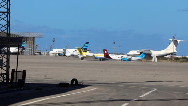 Airplanes are seen at Mitiga airport Airplanes are seen at Mitiga airport - Sputnik International