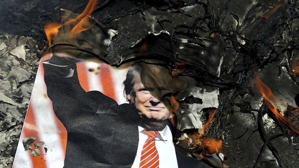 A poster of the U.S. President Donald Trump is set on fire during the annual anti-Israeli Al-Quds, Jerusalem, Day rally in Tehran, Iran, Friday, June 8, 2018 - Sputnik International
