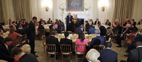 President Donald Trump bows his head in prayer as pastor Paula White leads the room in prayer during a dinner for evangelical leaders in the State Dining Room of the White House, Monday, Aug. 27, 2018, in Washington.  - Sputnik International