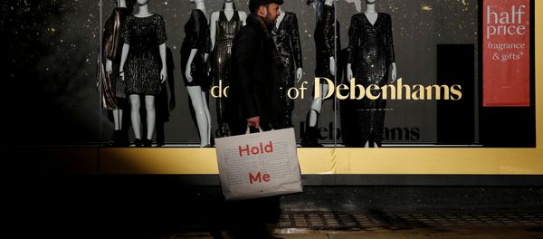 Shoppers walk past a window display at the Debenhams department store on Oxford Street in London Shoppers walk past a window display at the Debenhams department store on Oxford Street in London - Sputnik International
