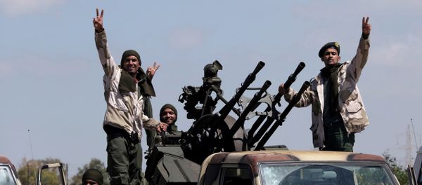Libyan National Army (LNA) members, commanded by Khalifa Haftar, head out of Benghazi to reinforce the troops advancing to Tripoli, in Benghazi, Libya April 7, 2019 - Sputnik International