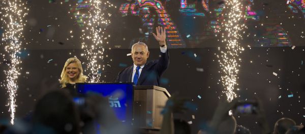 Israel's Prime Minister Benjamin Netanyahu accompanied by his wife Sara waves to his supporters after polls for Israel's general elections closed in Tel Aviv, Israel, Wednesday, April 10, 2019 - Sputnik International