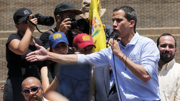 Opposition leader and self-proclaimed interim president Juan Guaido speaks to supporters during a rally to protest outages that left most of the country scrambling for days in the dark in Caracas, Venezuela, Saturday, April 6, 2019 Opposition leader and self-proclaimed interim president Juan Guaido speaks to supporters during a rally to protest outages that left most of the country scrambling for days in the dark in Caracas, Venezuela, Saturday, April 6, 2019 - Sputnik International