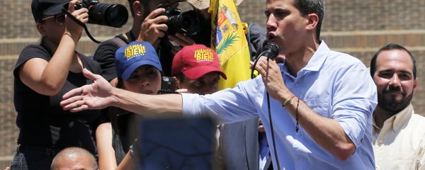 Opposition leader and self-proclaimed interim president Juan Guaido speaks to supporters during a rally to protest outages that left most of the country scrambling for days in the dark in Caracas, Venezuela, Saturday, April 6, 2019 - Sputnik International