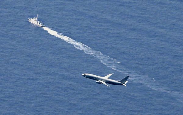 A Japan Coast Guard vessel and a U.S. military aircraft conduct rescue and search operations at the site where an Air Self-Defense Force's F-35A stealth fighter jet crashed during an exercise on April 9, 2019, off Aomori prefecture, Japan, in this photo taken by Kyodo April 10, 2019 - Sputnik International