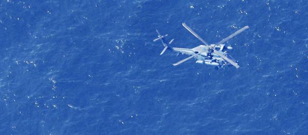A Japan Air Self-Defense Force helicopter conducts rescue and search operation at the site where an Air Self-Defense Force's F-35A stealth fighter jet crashed during an exercise on April 9, 2019, off Aomori prefecture, Japan, in this photo taken by Kyodo April 10 2019 A Japan Air Self-Defense Force helicopter conducts rescue and search operation at the site where an Air Self-Defense Force's F-35A stealth fighter jet crashed during an exercise on April 9, 2019, off Aomori prefecture, Japan, in this photo taken by Kyodo April 10 2019 - Sputnik International