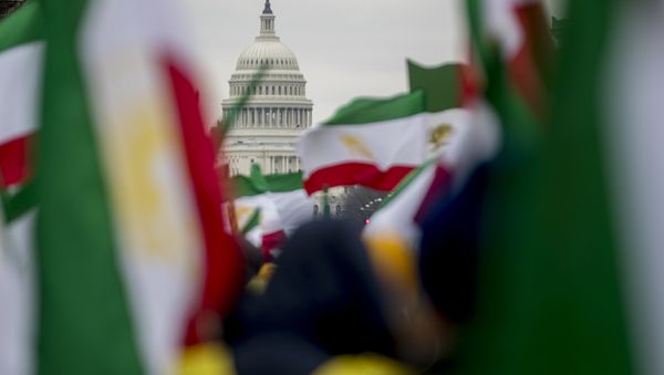 The Dome of the US Capitol building is visible through Iranian flags during an Organisation of Iranian-American Communities rally at Freedom Plaza in Washington, Friday, 8 March 2019. (AP Photo/Andrew Harnik) The Dome of the US Capitol building is visible through Iranian flags during an Organisation of Iranian-American Communities rally at Freedom Plaza in Washington, Friday, 8 March 2019. (AP Photo/Andrew Harnik) - Sputnik International