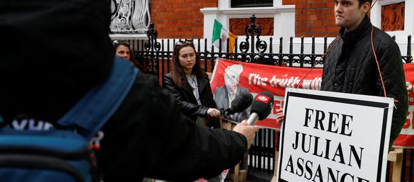 A supporter of WikiLeaks founder Julian Assange talks to the media, after Assange was arrested by British police, outside the Ecuadorian embassy in London, Britain, April 11, 2019 - Sputnik International