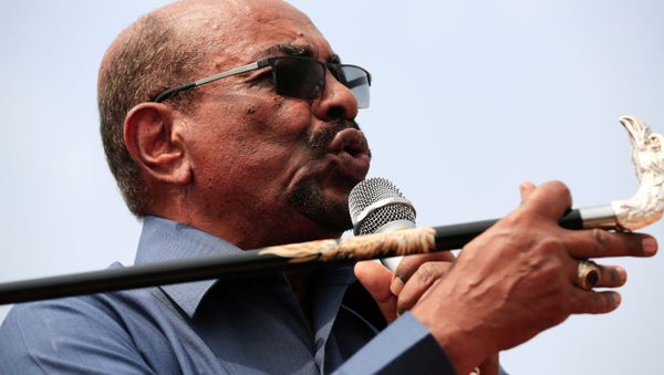 Sudan's President Omar al-Bashir addresses supporters during his visit to the war-torn Darfur region, in Bilal, Darfur, Sudan September 22, 2017 - Sputnik International