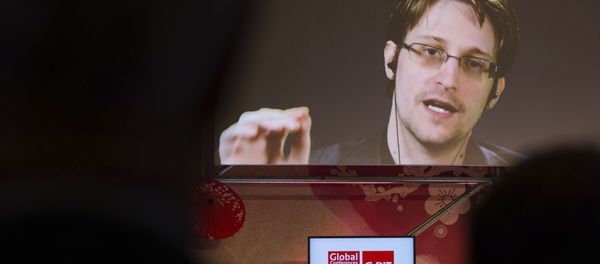 Edward Snowden, a former CIA worker before turning whistleblower, speaks via satellite at the IT fair CeBIT in Hanover, Germany, Tuesday March 21, 2017 Edward Snowden, a former CIA worker before turning whistleblower, speaks via satellite at the IT fair CeBIT in Hanover, Germany, Tuesday March 21, 2017 - Sputnik International