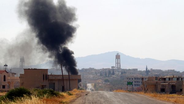 Smoke rises from Taybat al Imam town after rebel fighters from the hardline jihadist Jund al-Aqsa advanced in the town in Hama province, Syria August 31, 2016. (archives) - Sputnik International