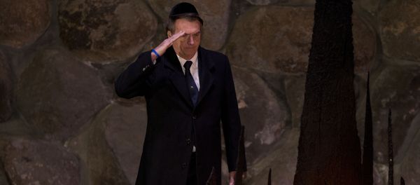 Brazil's President Jair Bolsonaro salutes during a ceremony commemorating the six million Jews killed by the Nazis during the Holocaust, in the Hall of Remembrance at Yad Vashem World Holocaust Remembrance Center Jerusalem, Tuesday, April 2, 2019. Brazil's President Jair Bolsonaro salutes during a ceremony commemorating the six million Jews killed by the Nazis during the Holocaust, in the Hall of Remembrance at Yad Vashem World Holocaust Remembrance Center Jerusalem, Tuesday, April 2, 2019. - Sputnik International