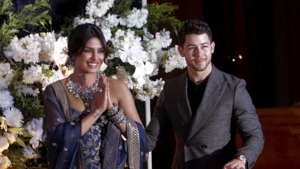 Bollywood actress Priyanka Chopra and musician Nick Jonas pose for photographs at their wedding reception in Mumbai, India, Wednesday, Dec 19, 2018 - Sputnik International