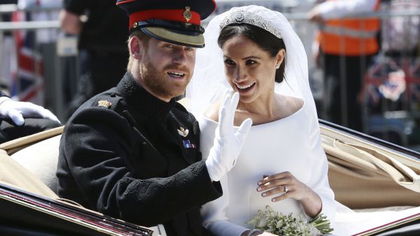 Britain's Prince Harry and Meghan Markle ride in an open-topped carriage after their wedding ceremony at St. George's Chapel in Windsor Castle in Windsor, near London, England, Saturday, May 19, 2018 - Sputnik International