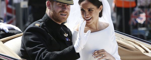 Britain's Prince Harry and Meghan Markle ride in an open-topped carriage after their wedding ceremony at St. George's Chapel in Windsor Castle in Windsor, near London, England, 19 May, 2018 Britain's Prince Harry and Meghan Markle ride in an open-topped carriage after their wedding ceremony at St. George's Chapel in Windsor Castle in Windsor, near London, England, 19 May, 2018 - Sputnik International
