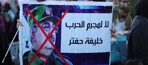 Libyan protesters attend a demonstration to demand an end to the Khalifa Haftar's offensive against Tripoli, in Martyrs Square in central Tripoli, Libya, 12 April, 2019 - Sputnik International