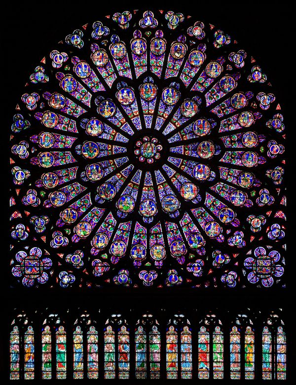 The north rose window of the Cathédrale Notre-Dame de Paris, an example of Rayonnant architecture, and the row of figures in stained glass below. - Sputnik International